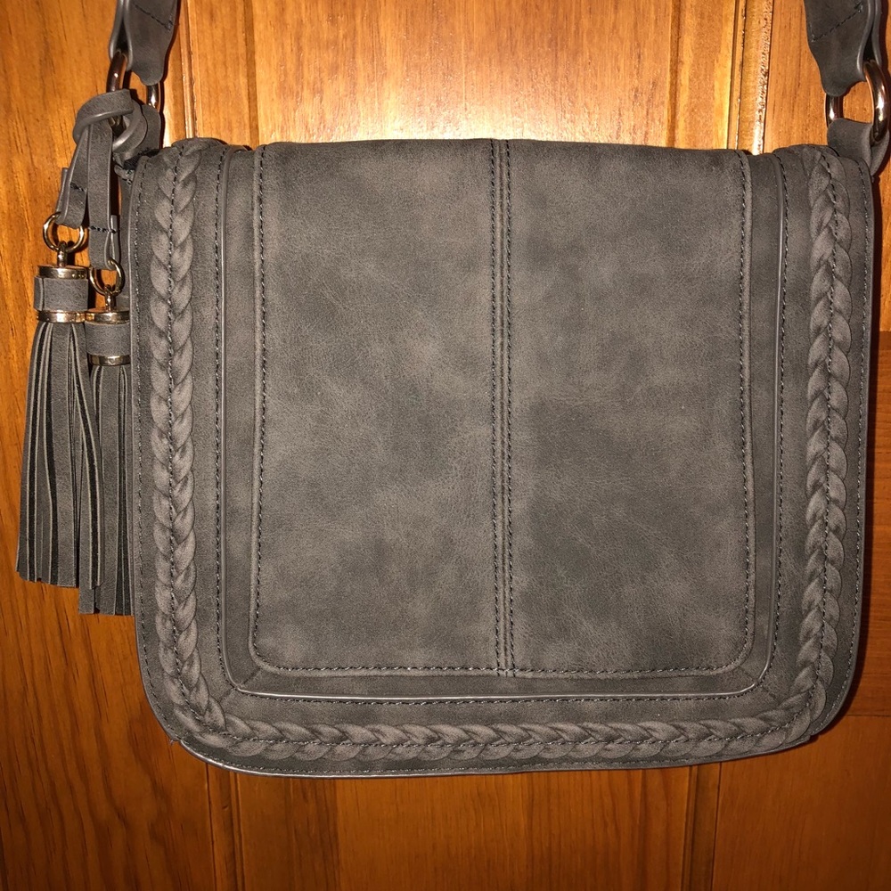 Francesca’s grey crossbody bag with tassels